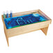 A Jonti-Craft wooden table with a drawing on a blue surface.