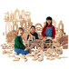 A group of children playing with Jonti-Craft hardwood blocks.