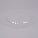 A Fineline clear plastic plate with a wavy edge.