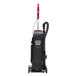 A black and red Sanitaire bagged upright vacuum cleaner with grey accents and wheels.