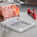 A clear plastic Cambro food pan lid with a flip clip.