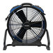 An XPOWER black and blue industrial axial fan on a stand.