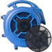 An XPOWER blue air mover with a black round fan cover.