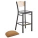 A Lancaster Table & Seating black wood bistro bar stool with a light brown vinyl cushion on the seat.
