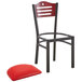 A Lancaster Table & Seating black metal bistro chair with a red vinyl cushion