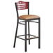A Lancaster Table & Seating black bistro bar stool with a light brown vinyl seat and mahogany wood back.