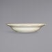 An International Tableware Victoria ivory stoneware bowl with a wavy edge.