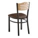 A Lancaster Table & Seating black bistro chair with a natural wood seat and back and dark brown vinyl seat.