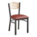 A Lancaster Table & Seating black bistro chair with a red vinyl seat.