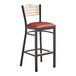 A Lancaster Table & Seating black bistro bar stool with a burgundy vinyl seat and natural wood back.