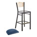 A black Lancaster Table & Seating bistro bar stool with a navy cushion.