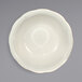 An International Tableware Victoria stoneware bowl with a scalloped edge and a rim.