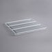 A white coated wire shelf for a GDN-5 series merchandiser.