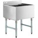 A large stainless steel Regency underbar ice bin with a drain on top and bottle holders.