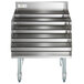 A stainless steel metal rack with four shelves.