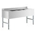 A Regency stainless steel underbar sink with two drainboards and three compartments on a counter.