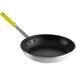 A close-up of a black and yellow Choice aluminum non-stick frying pan with a yellow handle.