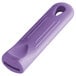 A purple silicone pan handle sleeve with a hole in it.
