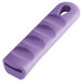 A purple silicone pan handle sleeve with a hole for a pan handle.