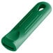 A green silicone pan handle sleeve with a hole in it.