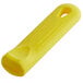 A yellow rectangular silicone sleeve with a hole for a pan handle.