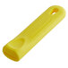 A yellow rectangular silicone sleeve with a hole in it.