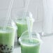 Three green drinks with Choice translucent pointed straws.
