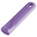 A purple silicone pan handle sleeve with a rectangular hole.
