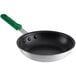 A close-up of a Choice aluminum non-stick frying pan with a green silicone handle.