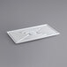 A white plastic rectangular tray with a curved spiral design.