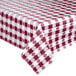 An Intedge burgundy gingham vinyl tablecloth with white checks on a table.