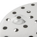 A close up of a circular metal Vollrath fryer basket with holes.