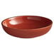 A brown stoneware bowl with a speckled red rim.