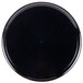 A black round catering tray with a high edge.