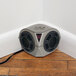 A Victor Pest Pestchaser Pro rodent repeller speaker sitting on the floor next to a wall in a room.