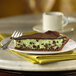 A slice of chocolate pie on a plate with a Keebler chocolate graham pie shell.