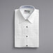 A folded white Henry Segal customizable tuxedo shirt with a black lay-down collar.