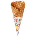 A Keebler Waffle Cone with ice cream inside and sprinkles on top.