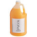 A white PAYA conditioner jug filled with orange liquid.
