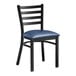 A black Lancaster Table & Seating metal ladder back chair with a navy blue cushion.