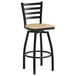 A Lancaster Table & Seating black ladder back bar stool with a natural wood seat.