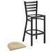 A Lancaster Table & Seating black metal bar stool with a natural wood seat.