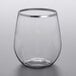 A Visions clear plastic stemless wine glass with a silver rim.