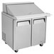 A Turbo Air stainless steel 2 door refrigerated sandwich prep table.