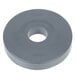 A grey circular rubber bumper with a hole in the center.