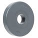 A gray circular rubber bumper with a hole in the center.
