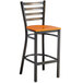A Lancaster Table & Seating distressed copper finish metal ladder back bar stool with a cherry wood seat.