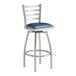 A Lancaster Table & Seating bar stool with navy vinyl padded seat and chrome legs.