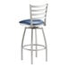 A Lancaster Table & Seating bar stool with a navy vinyl cushion and chrome legs.