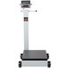 A Cardinal Detecto portable digital floor scale with wheels and a grey display tower.